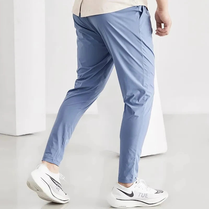 Pantaloni da corsa uomini abbigliamento sportivo jogging elastico pantaloni della tuta per palestra di fitness stretti rapido secco a secco per brani sottili da allenamento pantaloni sportivi