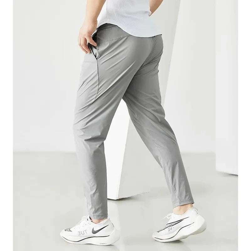 Pantaloni da corsa uomini abbigliamento sportivo jogging elastico pantaloni della tuta per palestra di fitness stretti rapido secco a secco per brani sottili da allenamento pantaloni sportivi