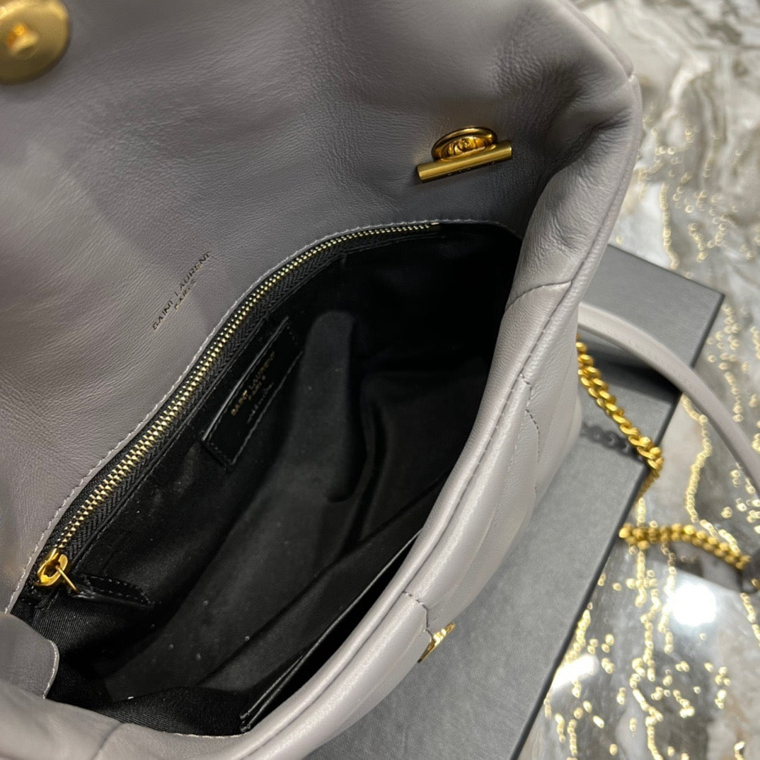  Gray quilted leather shoulder bag with gold-tone chain strap and soft, slouchy silhouette – a modern luxury accessory.