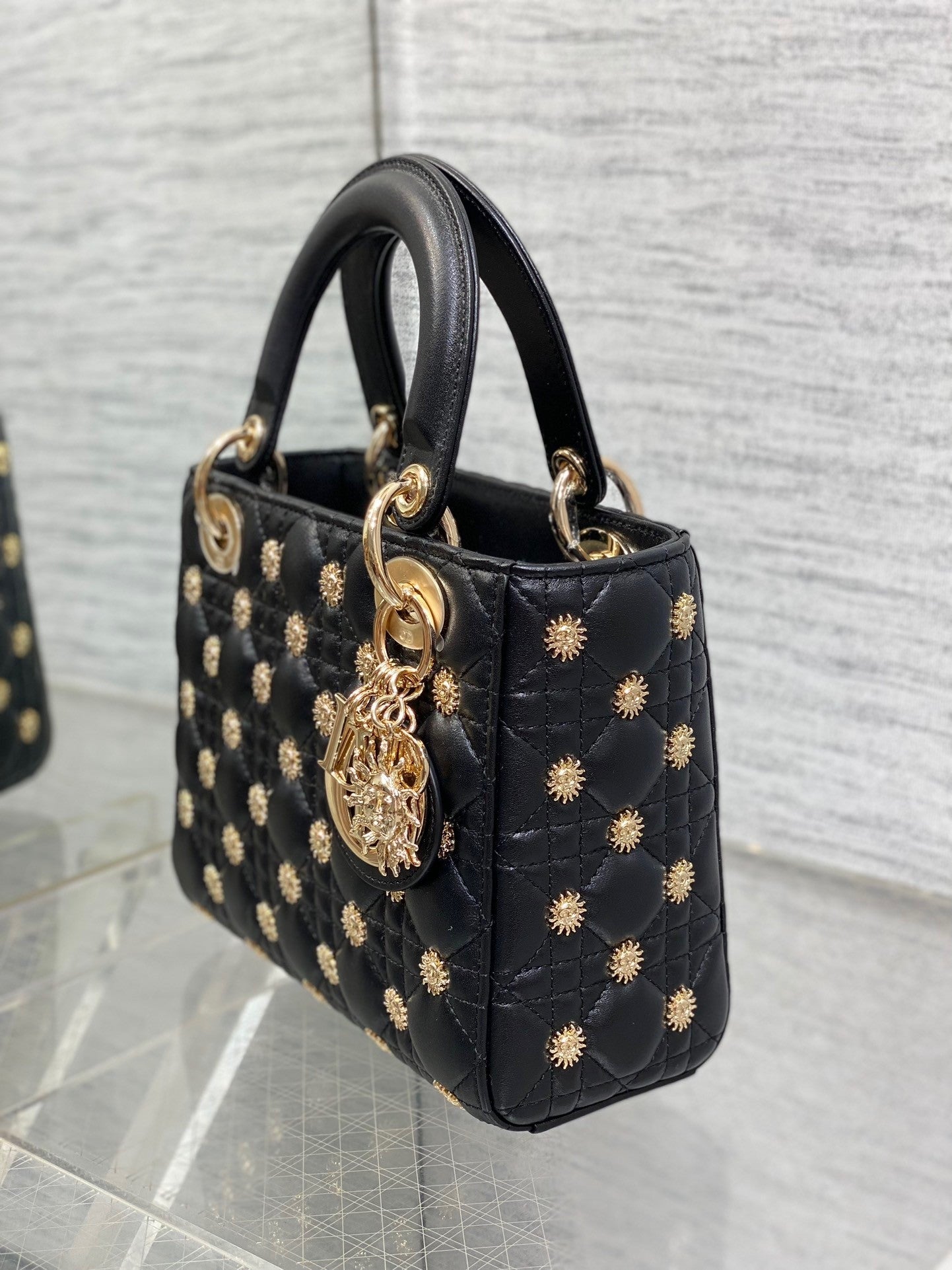 Luxury designer handbag with quilted leather, gold-tone hardware, and elegant structured silhouette—perfect for timeless sophistication