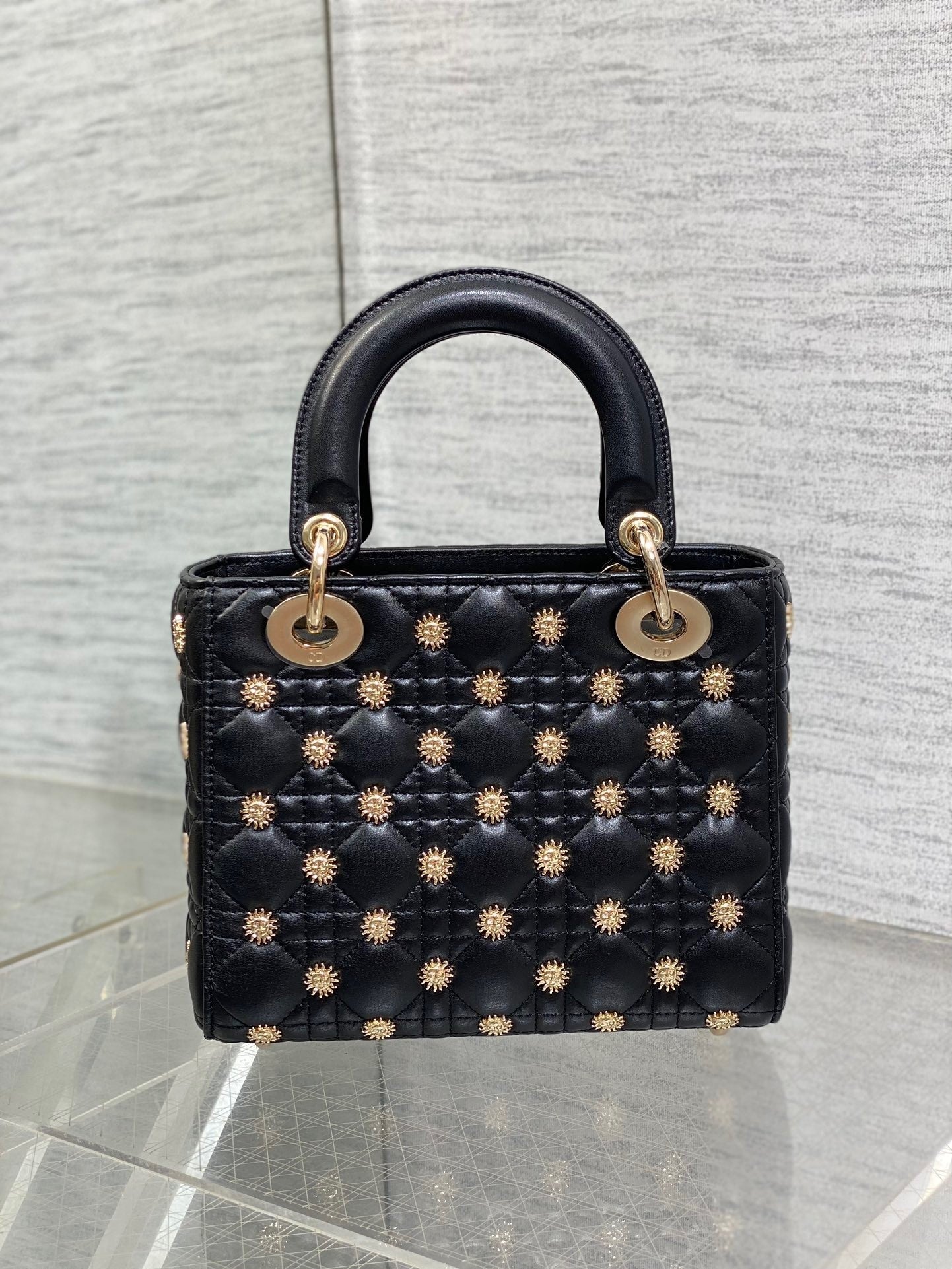 Luxury designer handbag with quilted leather, gold-tone hardware, and elegant structured silhouette—perfect for timeless sophistication