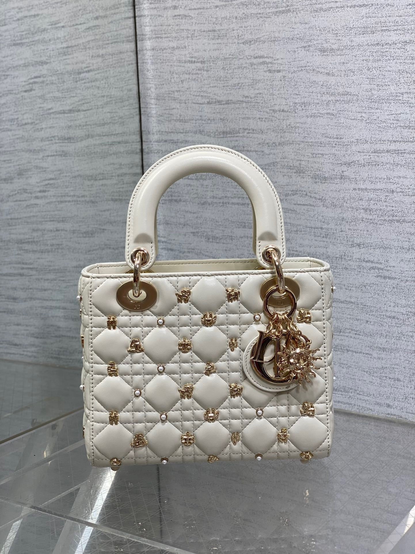  Luxury designer handbag with quilted leather, gold-tone hardware, and elegant structured silhouette—perfect for timeless sophistication.