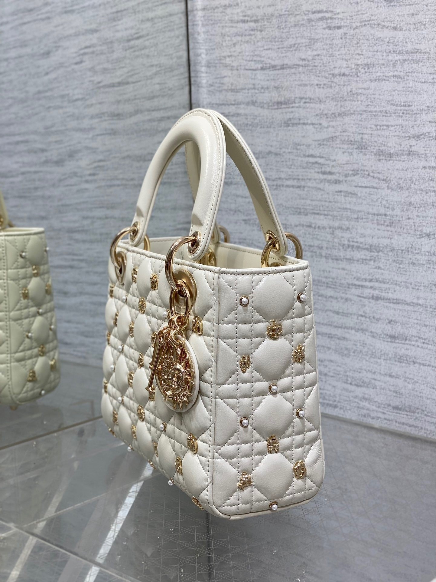  Luxury designer handbag with quilted leather, gold-tone hardware, and elegant structured silhouette—perfect for timeless sophistication.