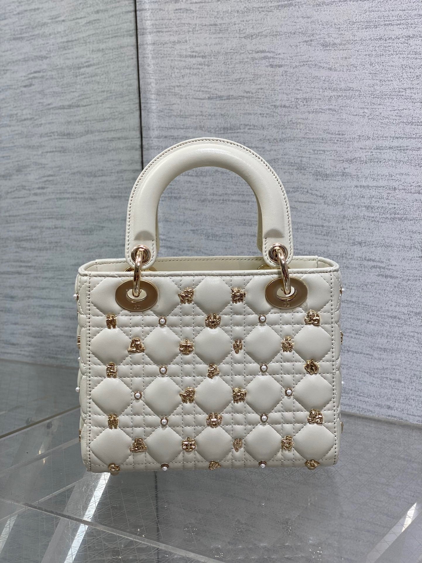  Luxury designer handbag with quilted leather, gold-tone hardware, and elegant structured silhouette—perfect for timeless sophistication.