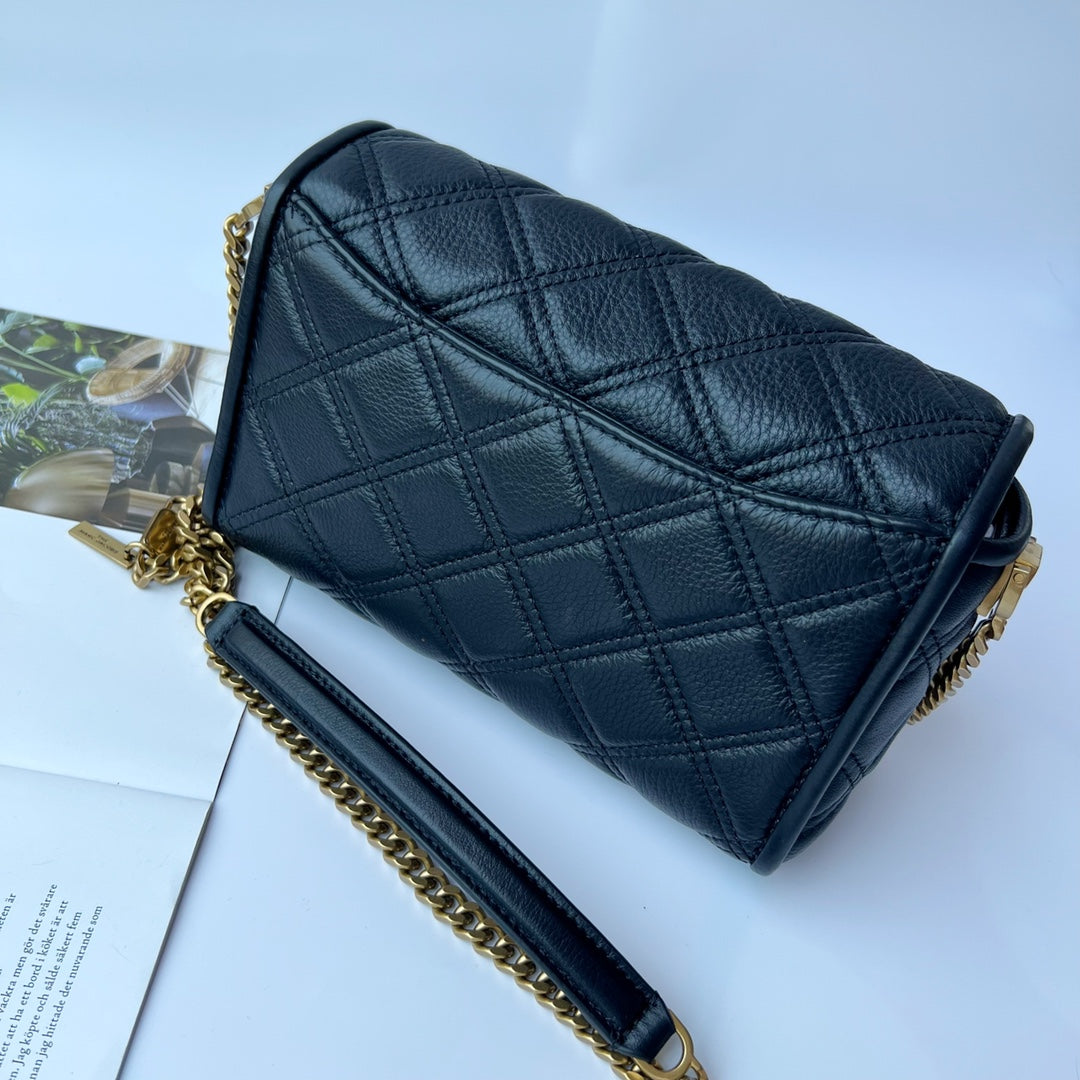 Black quilted leather shoulder bag with gold-tone chain strap and statement interwoven buckle – a timeless and versatile luxury handbag
