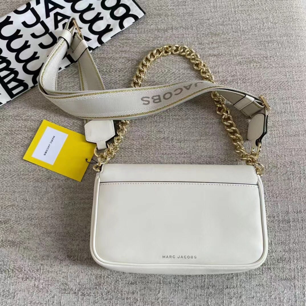 Ivory leather shoulder bag with gold-tone chain, adjustable fabric strap, and statement buckle – a modern minimalist handbag for every occasion